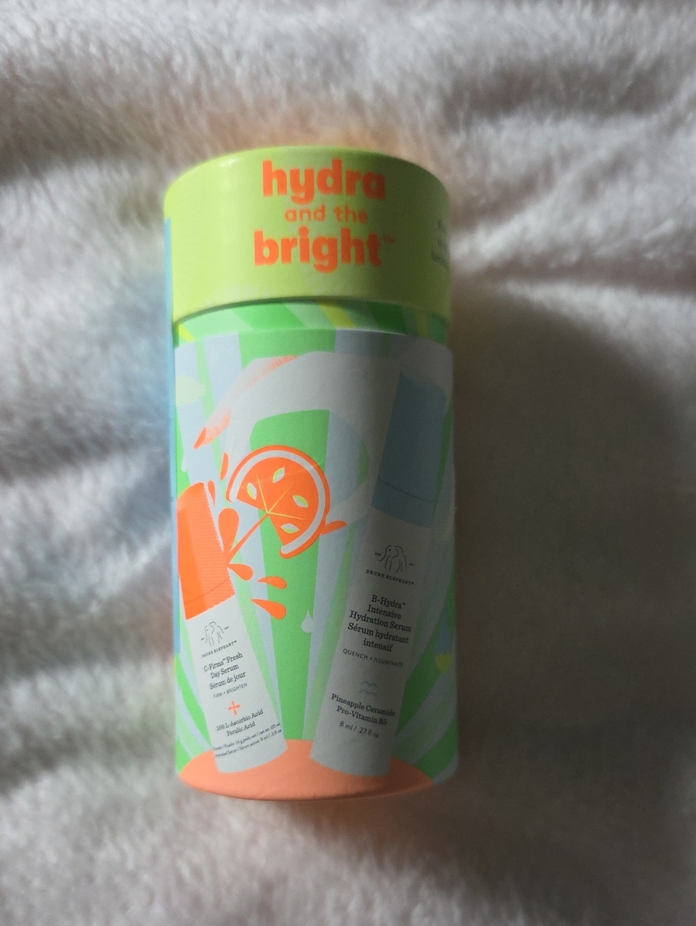 Drunk Elephant Hydrating Body Serum — Light Green & Orange Accents